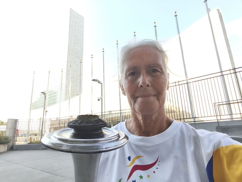 Lighting the Peace Torch at the United Nations the day after the swim