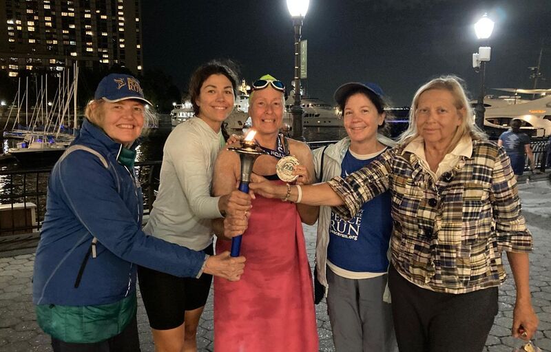 Sharing the Peace Torch with kayaker Dasha and helpers Jamini and Pipasa